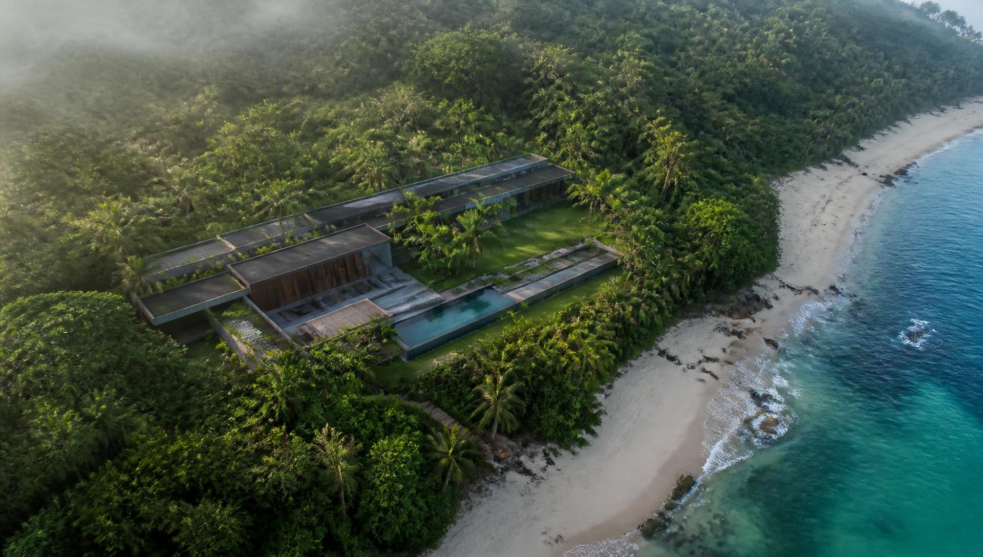 Aerial view of Raresweet Estate showing pavilions, pool, gardens, surrounding jungle and the beach